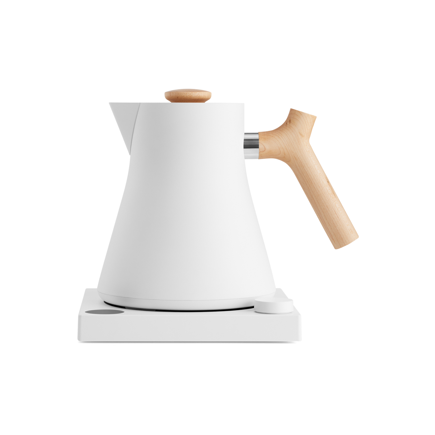 The Corvo EKG Electric Kettle by Fellow Wholesale showcases a sleek, modern design with a white matte finish, complemented by a wooden handle and lid knob. It rests on a matching white base with a small circular control button, and features variable temperature control along with quick heat time. The kettle's minimalistic style and clean lines contribute to its contemporary aesthetic.