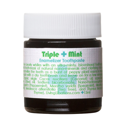 A small jar of Triple Mint Enamelizer Toothpaste from Living Libations highlights its organic ingredients, which include nano-hydroxyapatite, coconut oil, spearmint, and essential oils of tea tree and thyme.