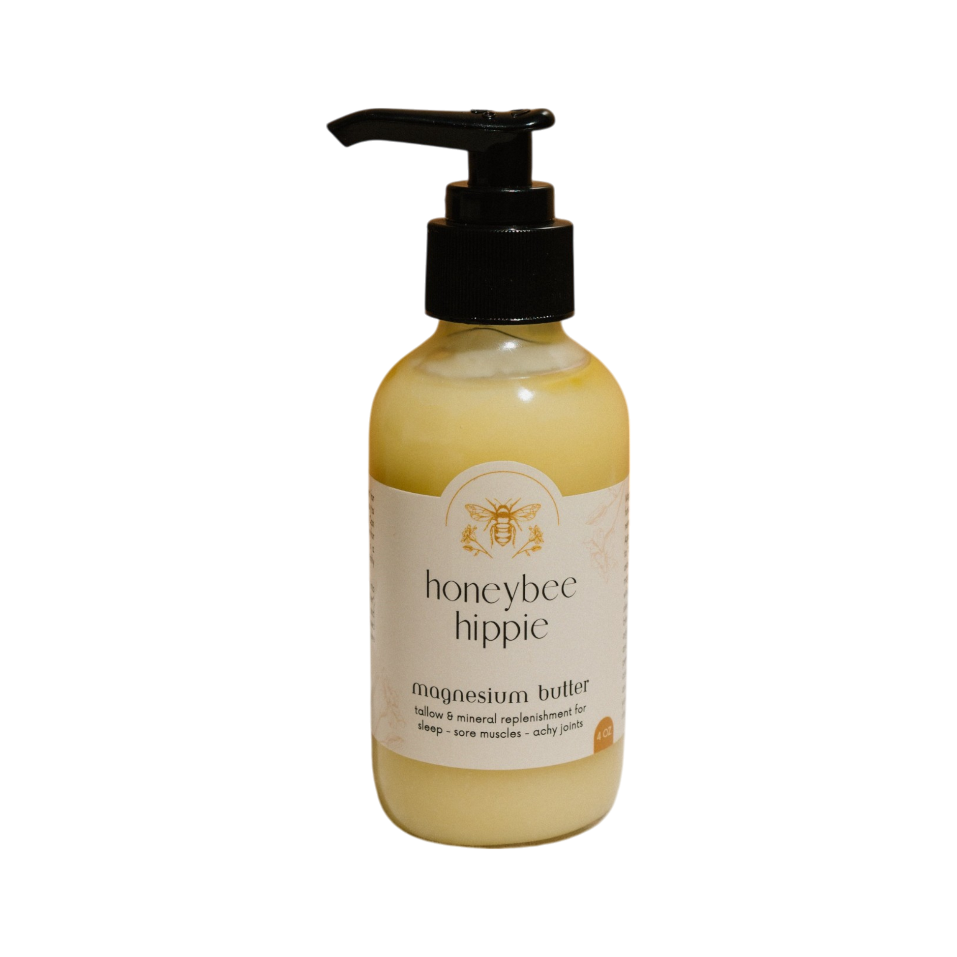 A Honeybee Hippie magnesium butter bottle, featuring a pump dispenser and set against a plain black background, boasts a label promising enhanced relaxation, restful sleep, and relief for sore muscles and achy joints.