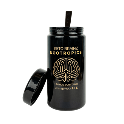 A black tumbler with a straw and an open lid beside it, branded with "Keto Brainz Nootropics" and the phrase “Change your brain. Change your life.” above an illustration of a brain, pairs perfectly with your Keto Brainz + Miron Glass Countertop Jar to optimize counter space efficiently.