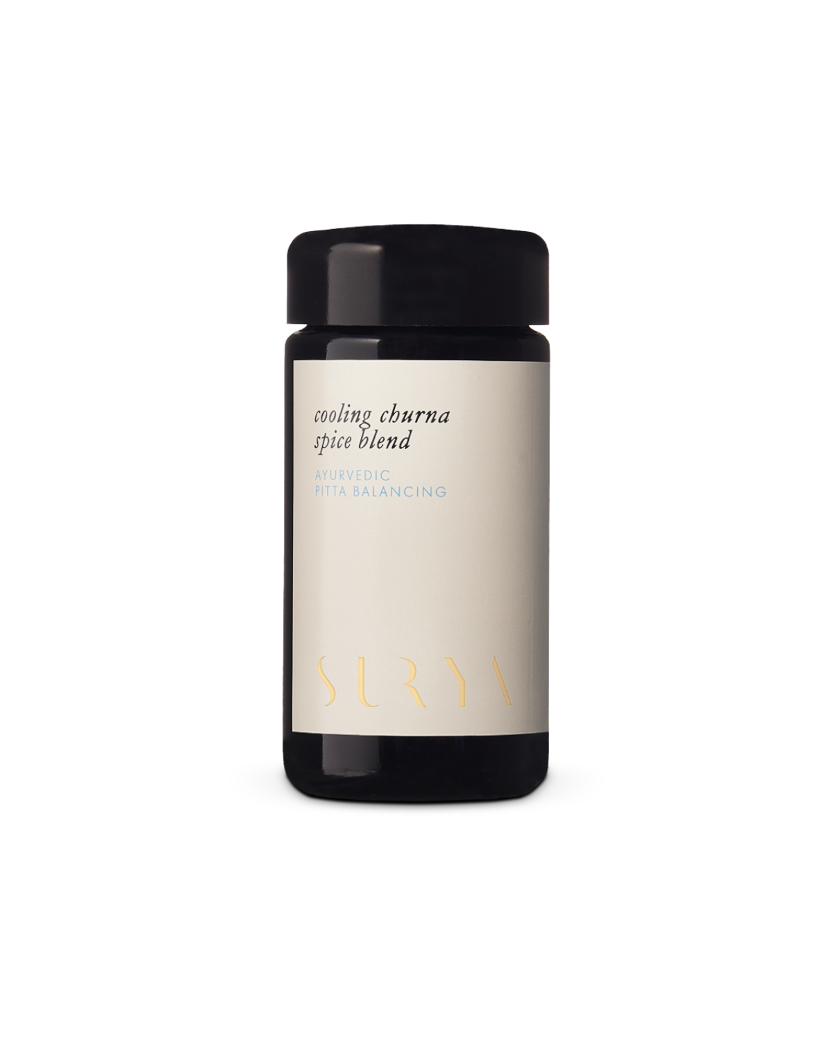 A dark glass jar labeled "Cooling Digestive Spice Blend" proudly bears the brand name "Surya," with its minimalist design and cream-colored label elegantly conveying a sense of tranquility and wellness.