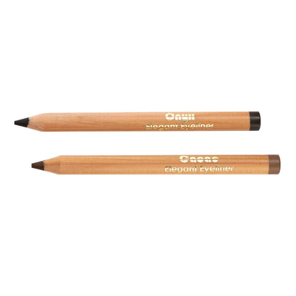 Two wooden eyeliner pencils are displayed horizontally. The top pencil, featuring the Onyx Elegant Eyeliner from Living Libations with an organic formula, has a black tip, while the bottom one has a brown tip. Both pencils have gold text reading "Elegant Eyeliner." The pencils' ends are capped in black and brown, respectively.