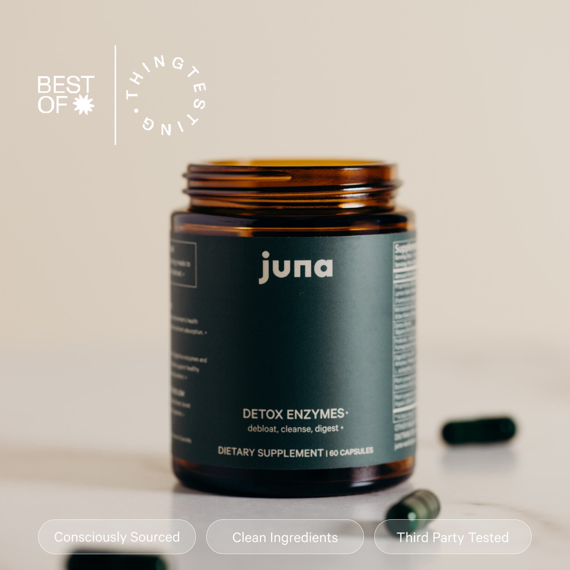 A brown bottle of Juna Detox Digestive Enzymes with a blurred background highlights the features "Consciously Sourced," "Clean Ingredients," and "Third Party Tested." This dietary supplement includes 60 capsules enriched with digestive enzymes. Three pills are placed next to the bottle, crafted to assist in natural debloating.