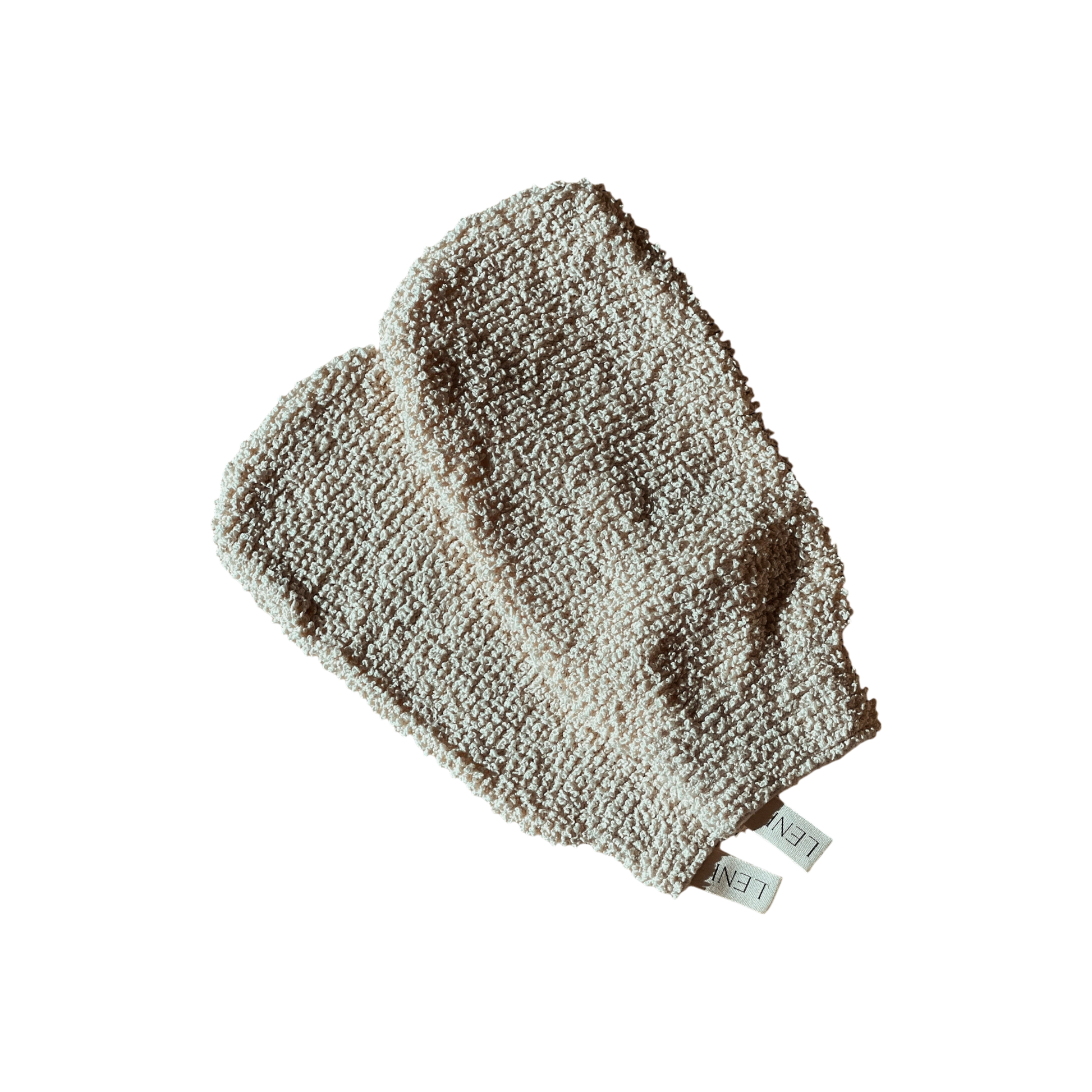 A pair of cream-colored, textured exfoliating mitts featuring small fabric tags labeled "LENI." Known as The Scrub Mitts, they are ideal for dry scrubbing. The mitts are showcased against a black background.