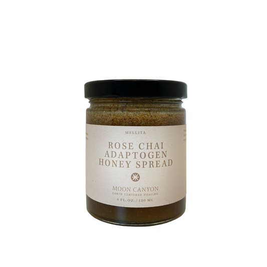 A glass jar with a black lid is labeled "Rose Chai Adaptogen Honey" by Moon Canyon Healing. The label also includes "Moon Canyon" and describes it as "Earth Certified Healing." Blended with chai spices for healthy circulation, the jar contains 4 fl. oz. (120 mL) of the product against a plain black background.