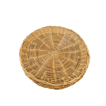 A set of 4 round, woven wicker plate holders with flat bottoms and slightly raised edges from Shoppe Maison. These vintage homewares, featuring a natural light brown color and intricate weaving pattern, create a rustic appearance, perfect for adding unique charm to any home setting. Displayed against a solid black background.