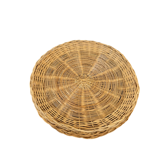 A set of 4 round, woven wicker plate holders with flat bottoms and slightly raised edges from Shoppe Maison. These vintage homewares, featuring a natural light brown color and intricate weaving pattern, create a rustic appearance, perfect for adding unique charm to any home setting. Displayed against a solid black background.