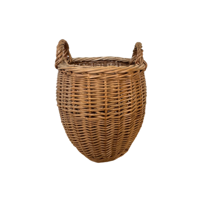 The Small Vintage Basket with Handles from Shoppe Maison showcases a round, woven wicker design complete with two curved handles on either side. Set against a plain black background, it accentuates the natural rustic texture and exemplary craftsmanship of quality homewares.