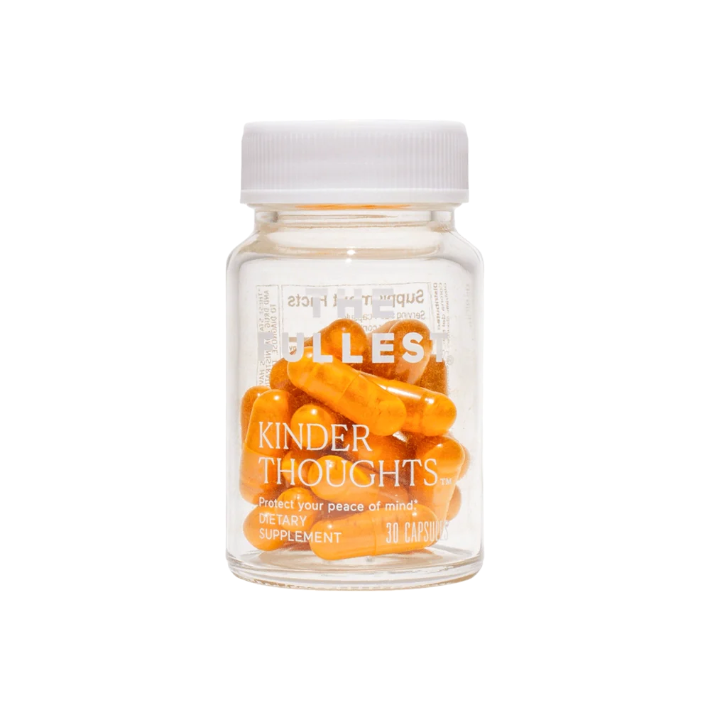 A clear bottle with a white cap contains orange capsules. The label on the bottle reads "Kinder Thoughts®" by THE FULLEST and "Protect your peace of mind. Saffron Supplement. 30 Capsules.