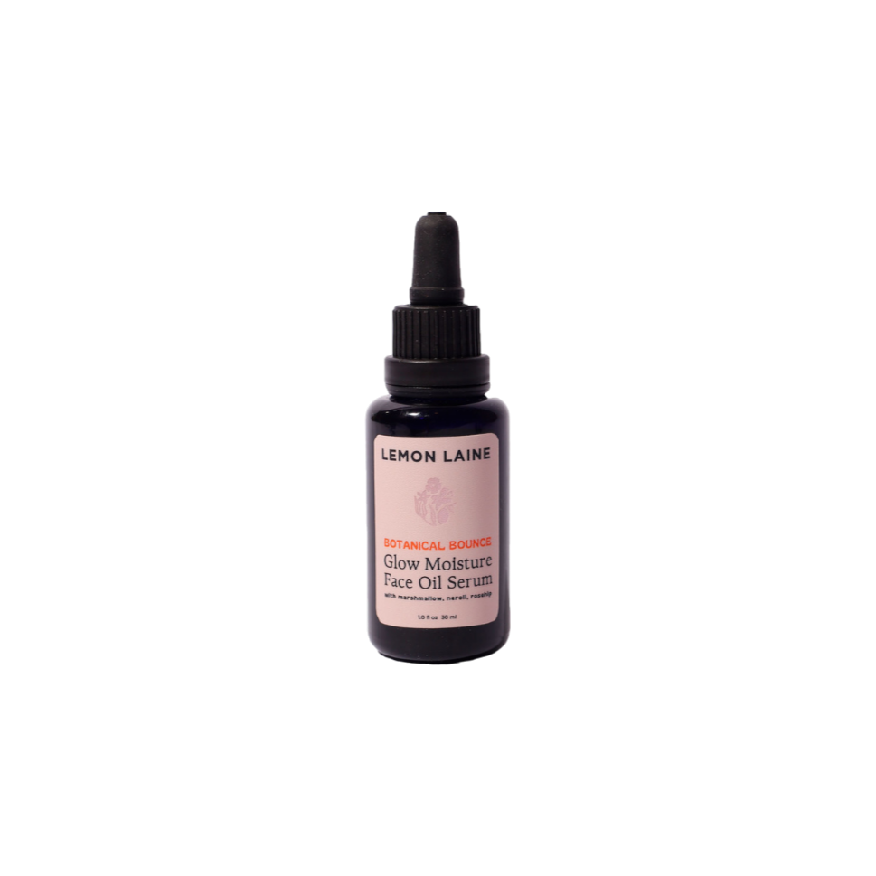 A sleek black dropper bottle labeled "LEMON LAINE" in white with a pink accent. The label displays "Botanical Bounce Glow Moisture Face Oil Serum." This luxurious formula, ideal for vegan skincare enthusiasts, includes a sophisticated black cap with an attached dropper.