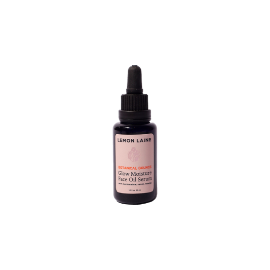 A sleek black dropper bottle labeled "LEMON LAINE" in white with a pink accent. The label displays "Botanical Bounce Glow Moisture Face Oil Serum." This luxurious formula, ideal for vegan skincare enthusiasts, includes a sophisticated black cap with an attached dropper.