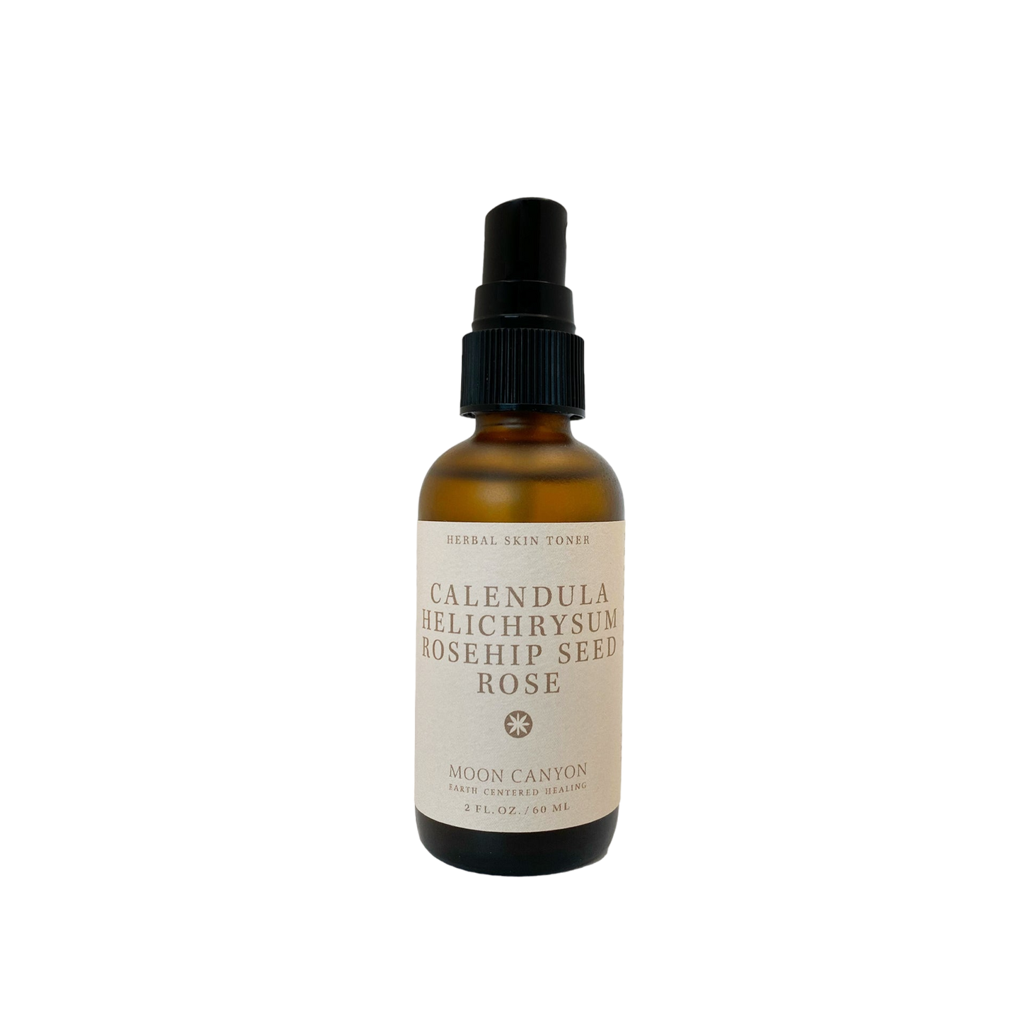 A brown glass bottle with a black pump dispenser labeled "Herbal Skin Toner" from Moon Canyon Healing features anti-inflammatory herbs such as Calendula, Helichrysum, and Rosehip Seed Rose. The 2 FL. OZ. / 60 ML bottle contains organic ingredients.