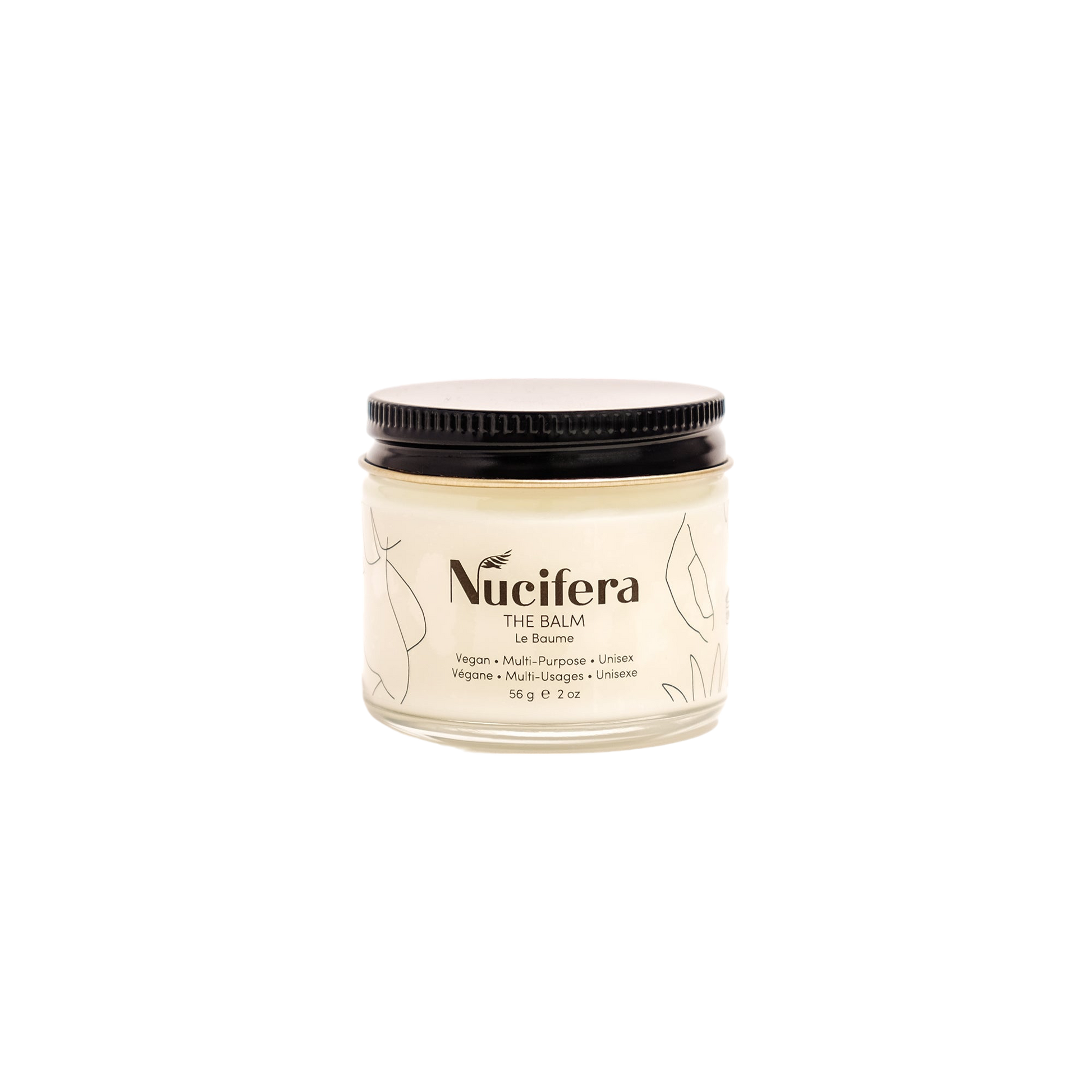 A 56-gram (2-ounce) glass jar of Nucifera Body Store's The Balm with a black screw-on lid. The label, adorned with minimalist line-drawn leaves, describes the product as a vegan unisex skincare essential, perfect for enhancing skin tone and texture.