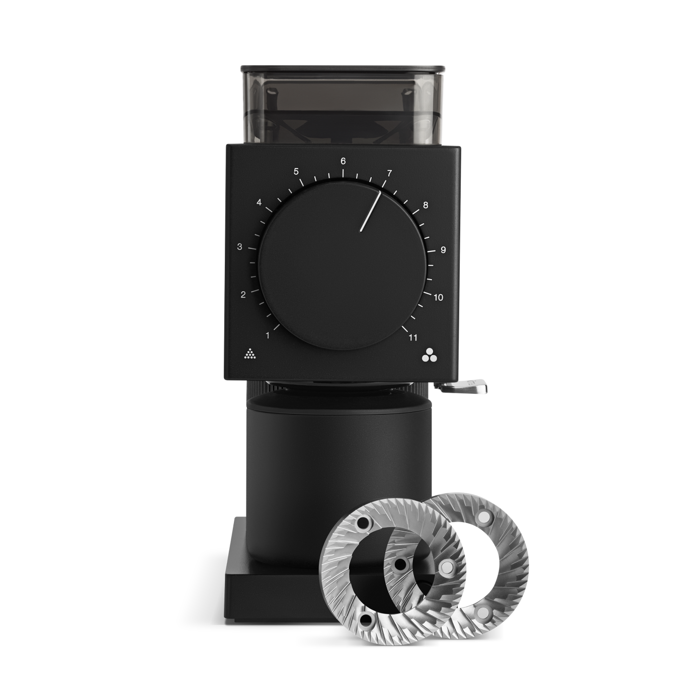 The Ode Brew Grinder by Fellow Wholesale is a sleek, black coffee grinder with a large circular dial on the front set at number 7 and a transparent hopper on top. Featuring Gen 2 Brew Burrs, two shiny, silver burr grinder discs are placed in front of the grinder on a reflective surface.