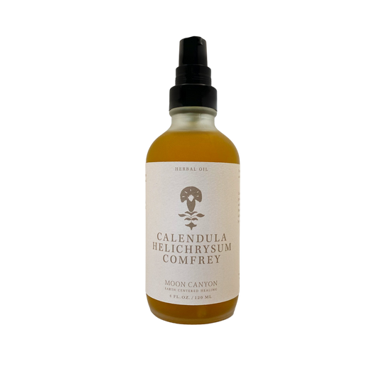 A 4 fl oz (120 ml) bottle of "Calendula, Helichrysum & Comfrey Herbal Oil" from Moon Canyon Healing. The bottle is equipped with a pump dispenser and features a beige label with minimalist design elements set against a black background.