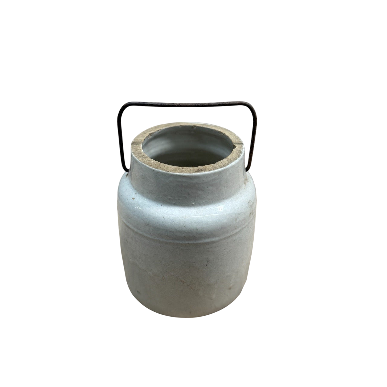 A grey, cylindrical ceramic jug with an open top and a bail wire handle is centered on a plain black background. Resembling a vintage stoneware milking crock, the Vintage Stoneware Milking Jug from Shoppe Maison has a slightly tapered shape with a wide mouth, showcasing its rustic and minimalistic design.