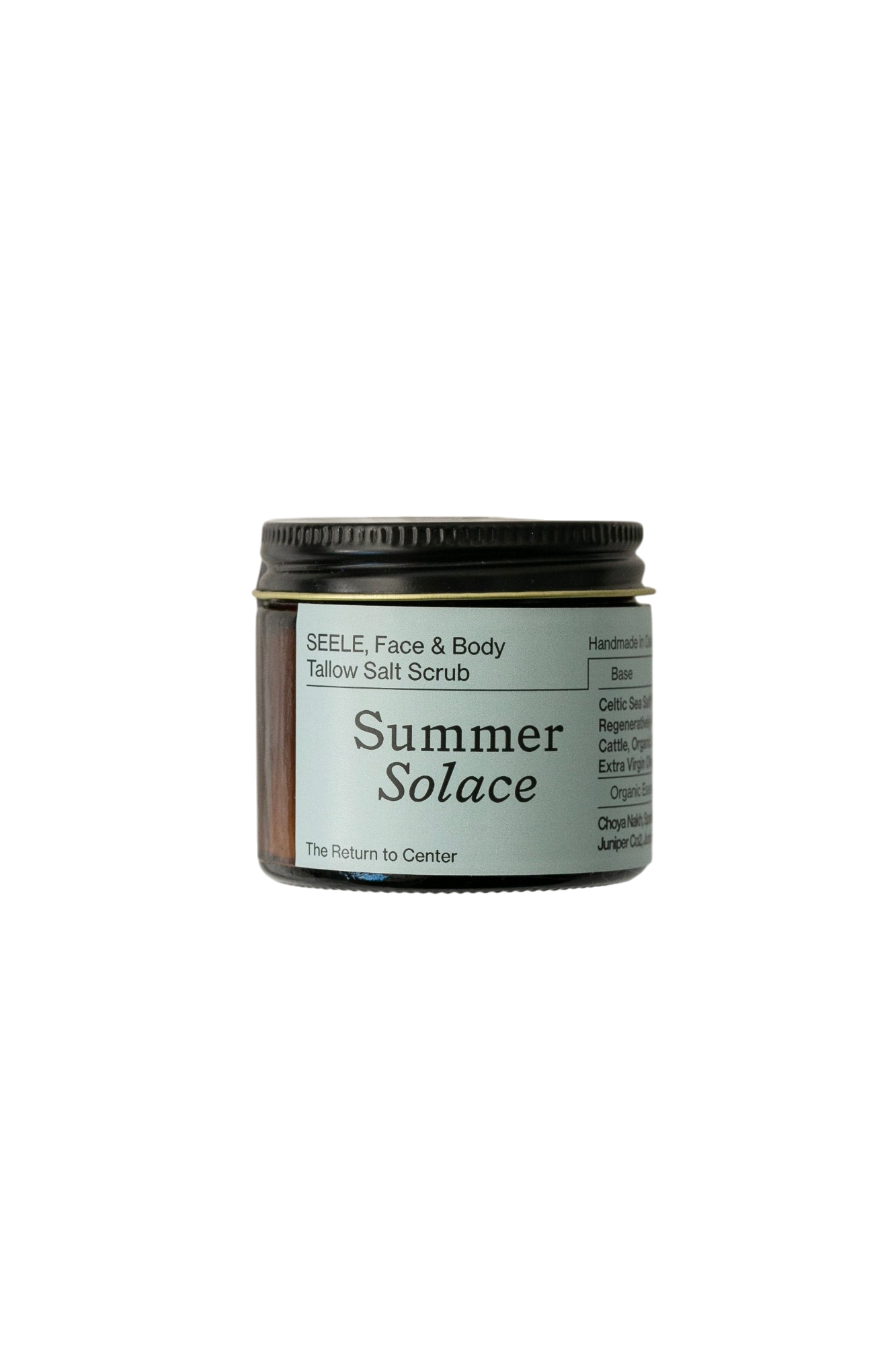 A jar of "SEELE Celtic Sea Salt® Scrub - Regenerative Tallow®" from Summer Solace Tallow is set against a black background. Ideal for face and body, it features natural ingredients like tallow and essential oils as listed on the label.