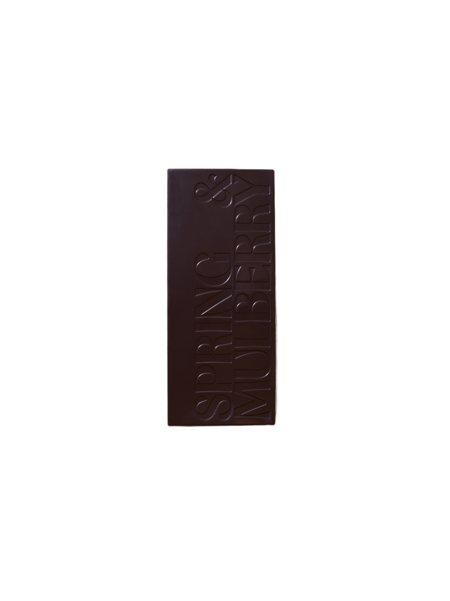 A Pure Dark Date-Sweetened Chocolate bar from Spring & Mulberry, with "SPRING & MULBERRY" engraved in large, bold letters vertically aligned on its surface against a plain black background.