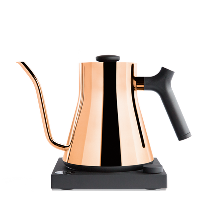 A sleek, copper Stagg EKG Electric Kettle by Fellow Wholesale featuring a precise gooseneck spout, a black handle, and resting on a black base.