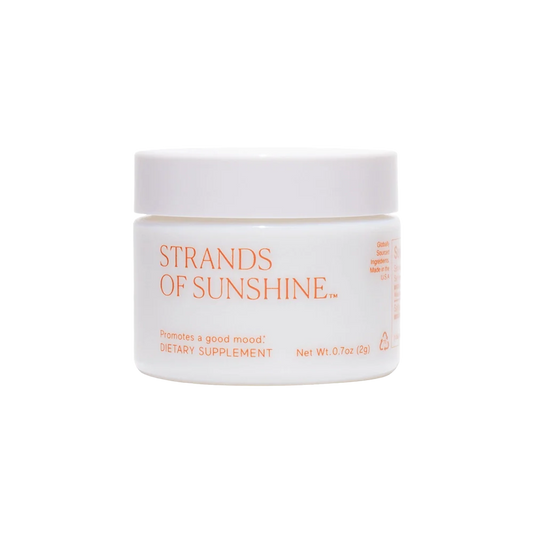 A white, round container with an orange lid, labeled "Strands of Sunshine" by THE FULLEST. Described as a dietary supplement containing medicinal saffron, the front text indicates it promotes a good mood and provides anxiety support. The net weight is 0.7 oz (20g).