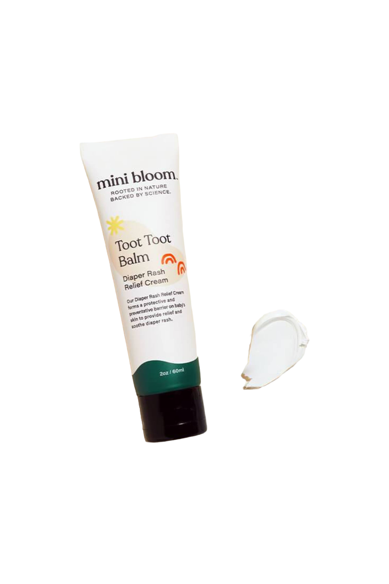 Image of a tube of mini bloom Toot Toot Diaper Rash Balm. The tube is white with orange and black text, featuring a green base. A small dollop of the cream is placed next to the tube, showcasing its ability to create a protective barrier that soothes irritated skin.