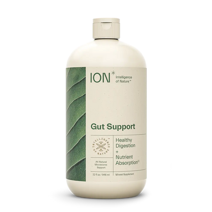 A white bottle labeled "ION* Gut Support" with a leaf design on the left side. The label states "Healthy Digestion + Nutrient Absorption" and highlights "All Natural Microbiome Support." This daily wellness supplement by ION* contains 32 fl oz (946 ml) of mineral support for optimal gut health.