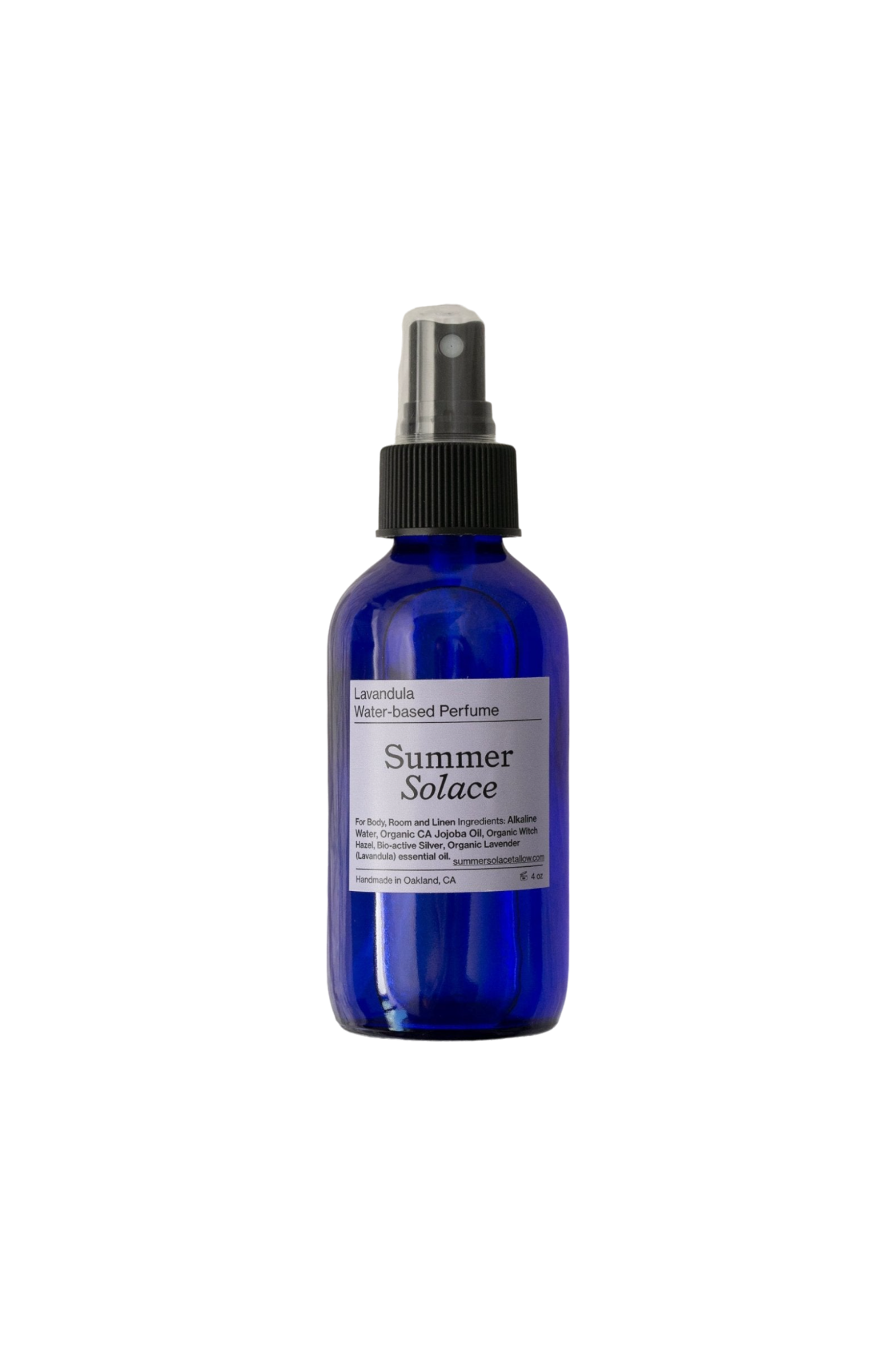 A blue glass bottle with a spray nozzle labeled "Lavandula (with Lotus Ormus) Water-Based Toner Mist" and "Summer Solace Tallow," featuring organic Bulgarian lavender. The label also includes comprehensive details about the product and company. The bottle is set against a plain black background.