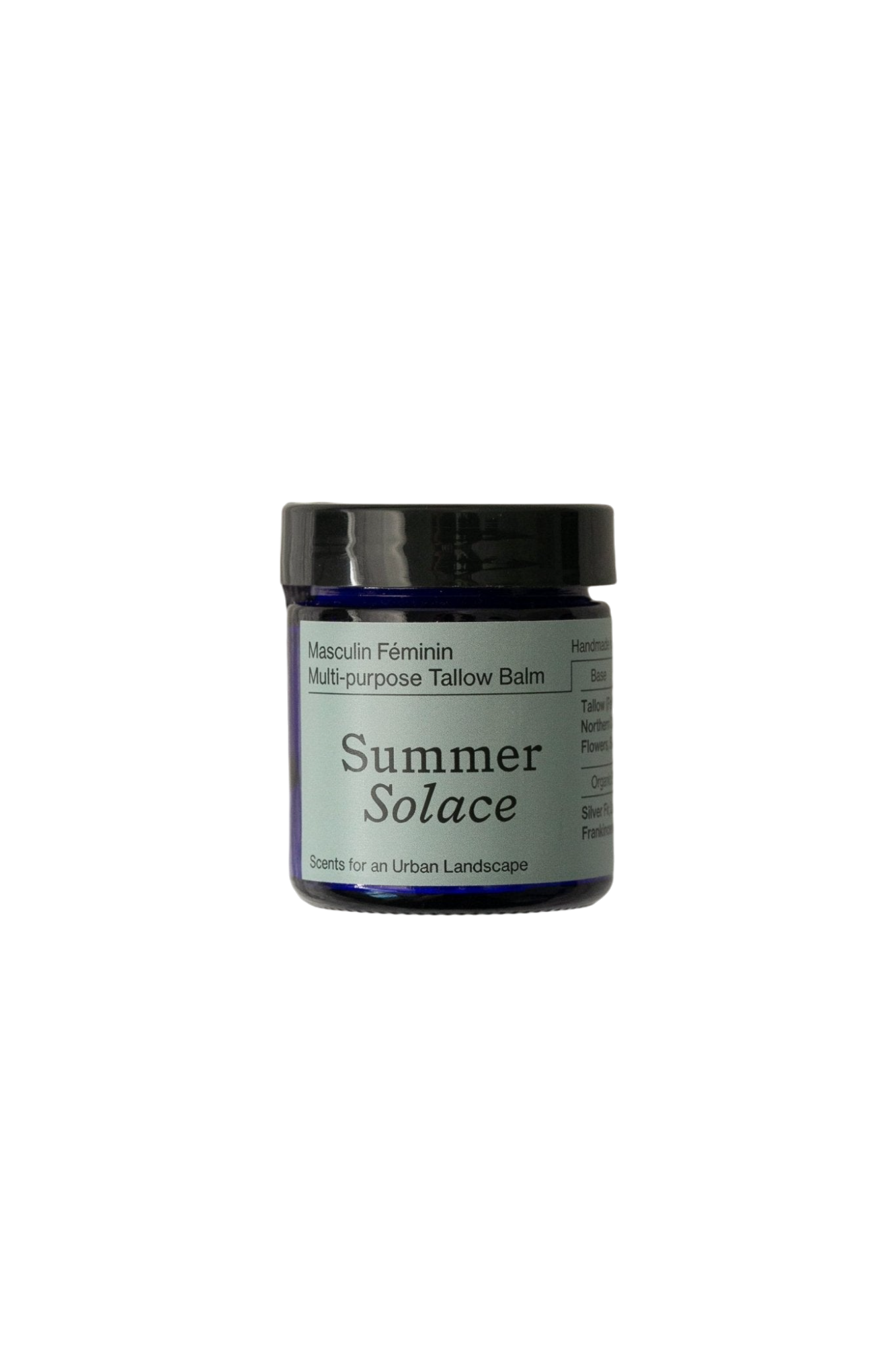 A small cobalt blue jar of Summer Solace Tallow’s Masculin Féminin Balm - Regenerative Tallow™ unisex tallow balm features a minimalist design and a black lid. The label reads "Masculin Féminin Multi-purpose Tallow Balm" and "Scents for an Urban Landscape," perfect for versatile skincare.