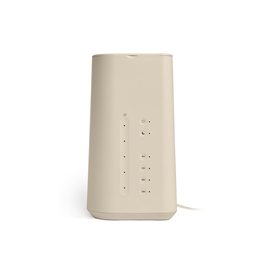 The Cloud Humidifier by Vitruvi is a beige, cylindrical electronic device featuring multiple small indicator lights in a vertical line, buttons for adjustable mist levels, and ports on its front. Utilizing ultrasonic technology, the Cloud Humidifier showcases a flat top and bottom with a smooth, minimalist design.