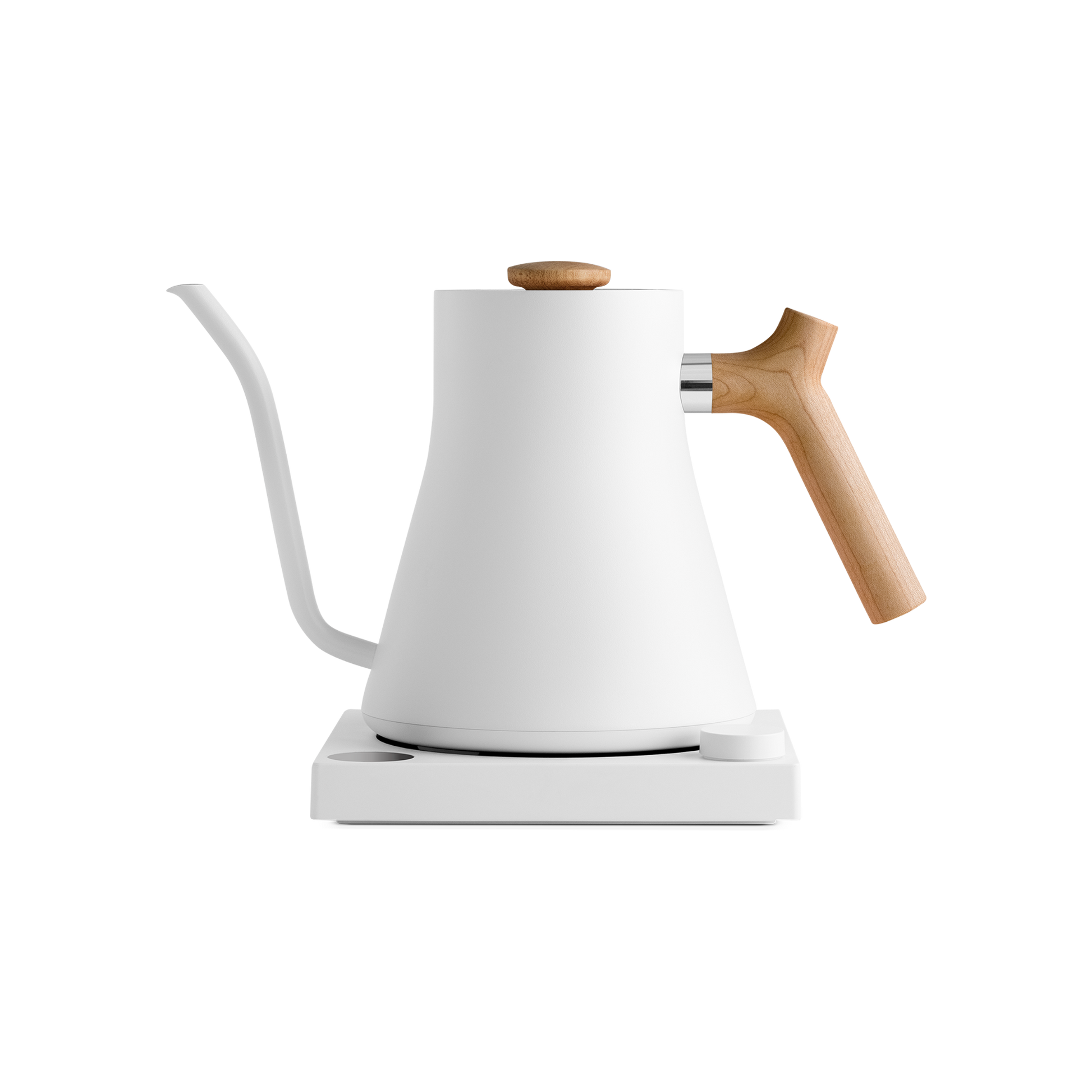 A modern white Fellow Wholesale Stagg EKG Electric Kettle with a matte finish is placed on a matching white base. It features a gooseneck spout and light wooden handle and lid knob. The sleek design combines variable temperature control with aesthetics, making it ideal for precision pouring in pour-over coffee.
