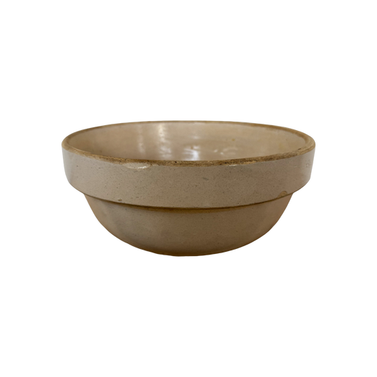 A Vintage Stoneware Mixing Bowl by Shoppe Maison with a smooth cream finish sits on a plain background. This elegant piece features a slightly raised rim and a rounded body, embodying the timeless appeal of vintage homewares.