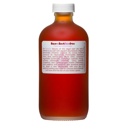 A brown frosted glass bottle with a white screw cap contains the Best Skin Ever Cleanser - Rose by Living Libations. The white label with red text displays the product name "Rose Otto BestSkinEver" and includes ingredients and usage instructions.