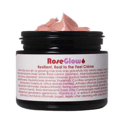 A black jar from Living Libations contains the Rose Glow Crème, a resilient and true-to-the-feel moisturizer with pink cream inside. The jar lists ingredients such as rose oil, rose hydrosol, aloe vera, jojoba oil, and various vitamins. The open jar has a dollop of the botanical moisturizer placed on its lid.