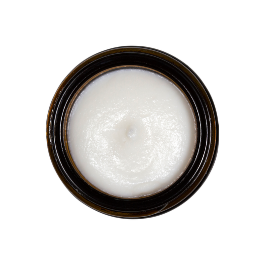 A small jar of Triple Mint Enamelizer Toothpaste from Living Libations highlights its organic ingredients, which include nano-hydroxyapatite, coconut oil, spearmint, and essential oils of tea tree and thyme.