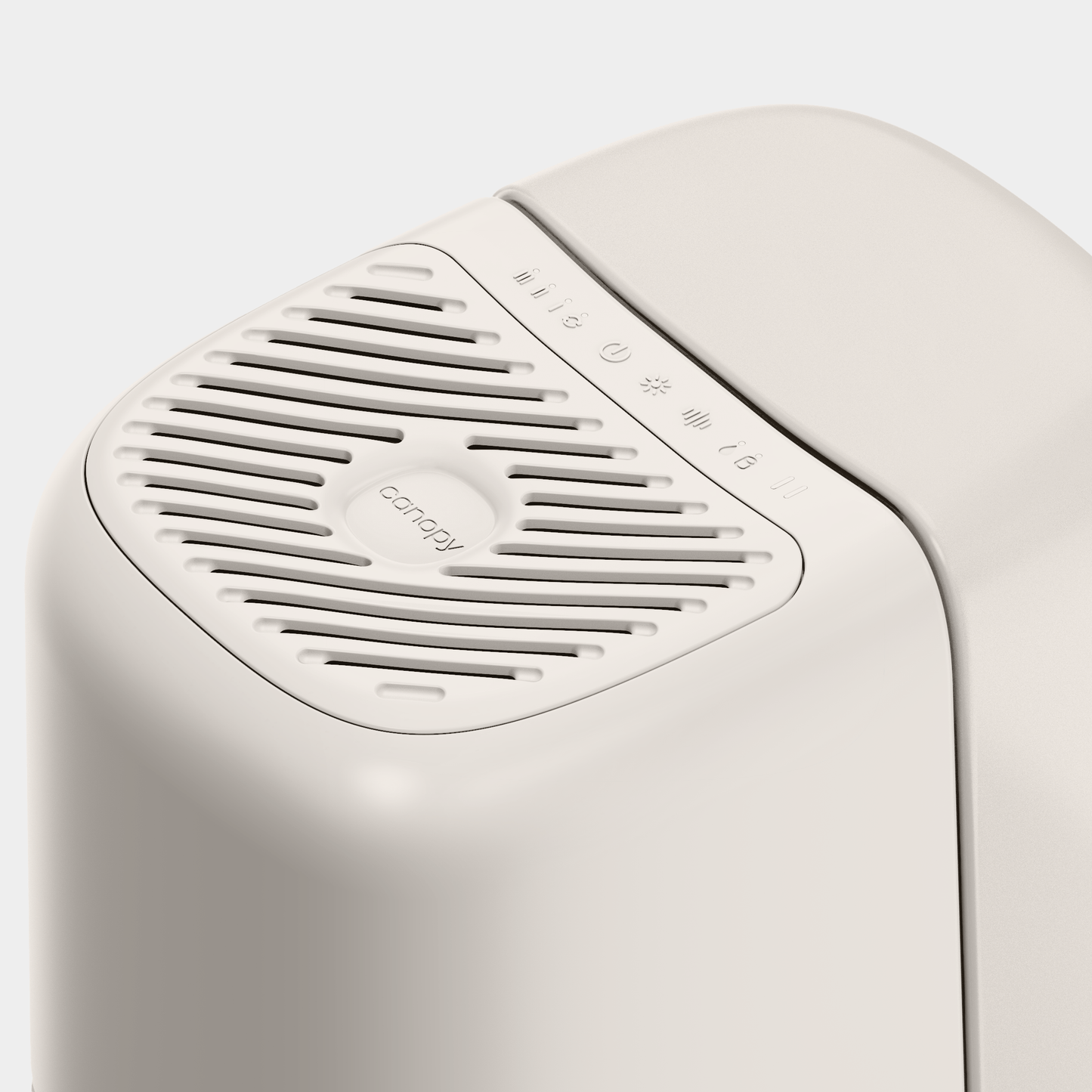 The sleek white Canopy Bedside Humidifier 2.0 features a vented top with the brand logo and control symbols for power and humidity levels on its smooth surface. Its minimalist design is crafted to keep your air purified and enhance comfort.