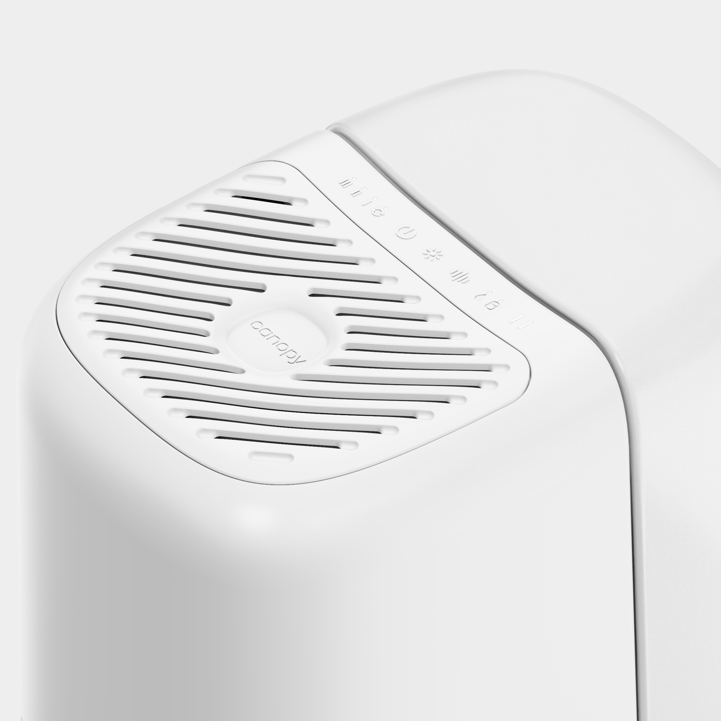 Close-up of a white Bedside Humidifier 2.0 by Canopy, showcasing a modern, sleek design. The top features vent openings and small control icons: a power button, a light, and a water droplet symbol. Fulfilled by Canopy.