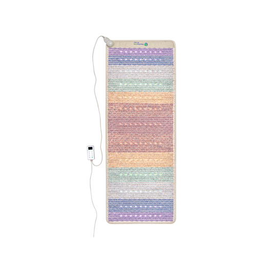 The HealthyLine Rainbow Chakra Mat™ Large 7428 Firm - PEMF Inframat Pro® Third Edition is a rectangular mat with horizontal pastel stripes in shades of purple, pink, orange, and green designed for chakra cleansing. It comes with a white controller featuring buttons and a small display screen, connected to the top left corner of the mat.