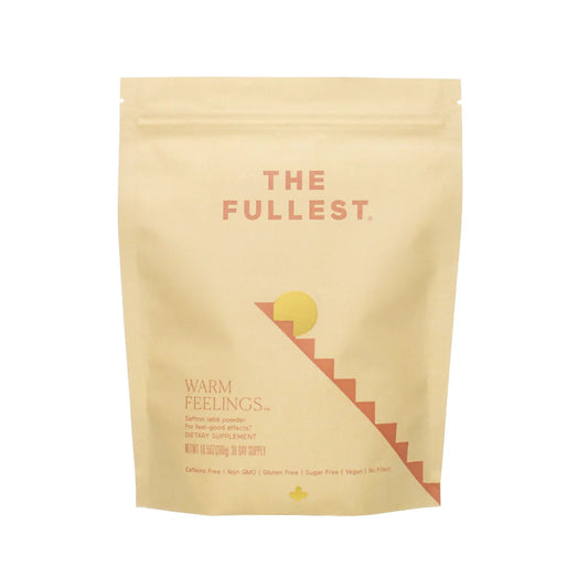 A dietary supplement intended to enhance mood, the "Warm Feelings 30-Day Supply" from THE FULLEST comes in a beige resealable pouch adorned with a stylized sun graphic. This caffeine-free, non-GMO, gluten-free, and sugar-free product contains 30 sachets.